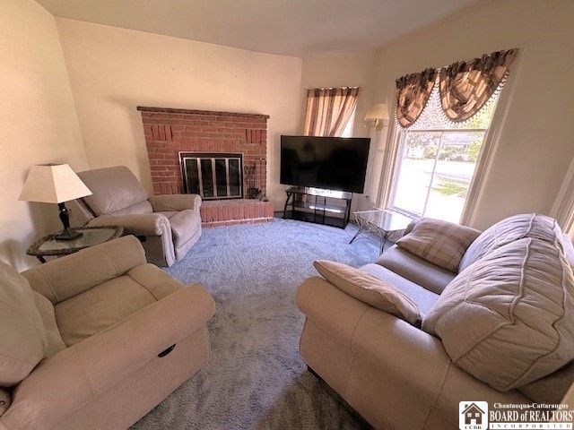 carpeted living room featuring a fireplace