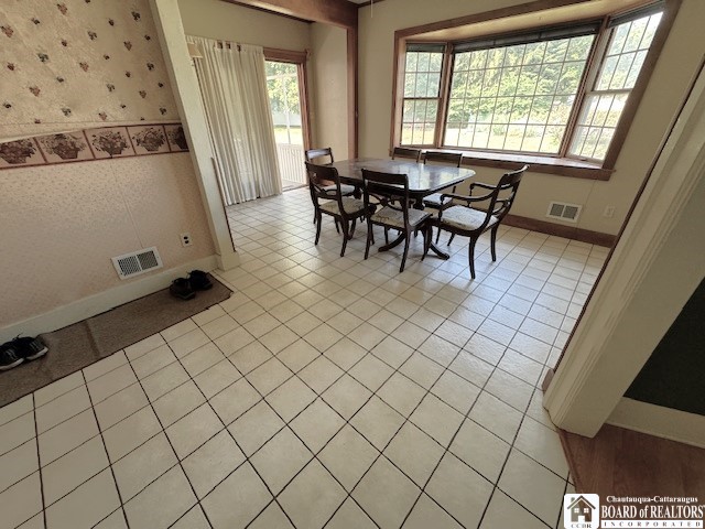 dining room with light tile patterned floors