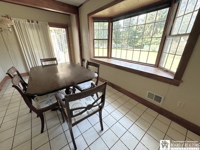 dining room featuring light tile patterned floors