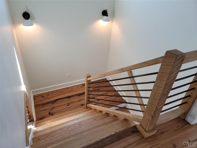 stairway featuring hardwood / wood-style flooring