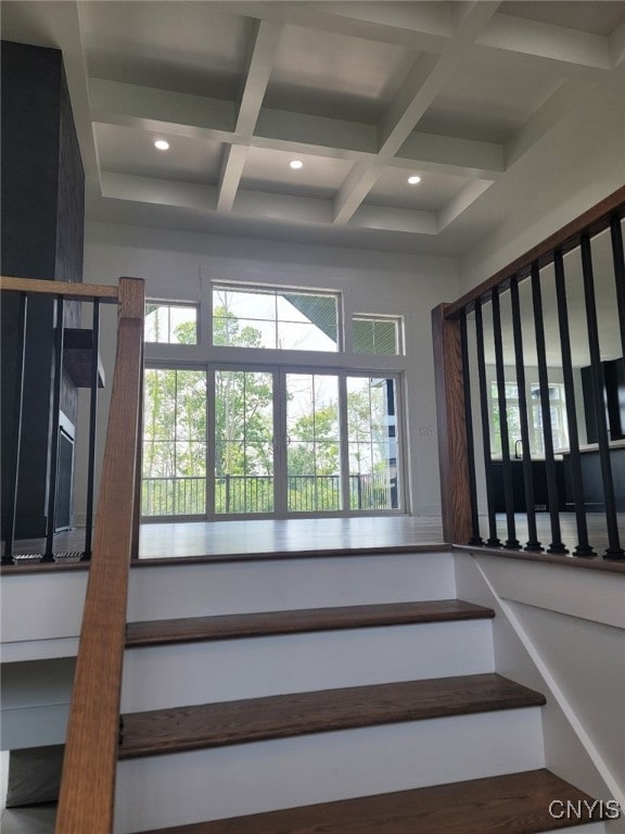 stairway with coffered ceiling and beam ceiling