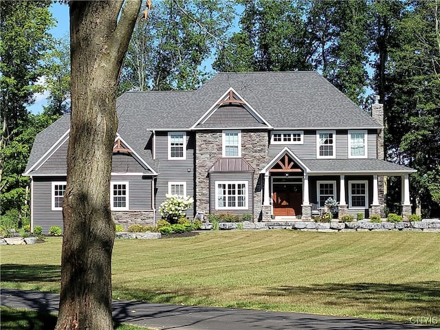 craftsman-style home with a front lawn