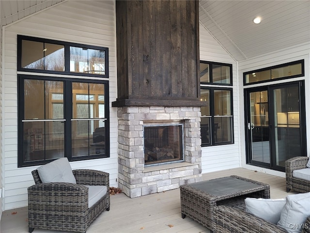 exterior space with a stone fireplace