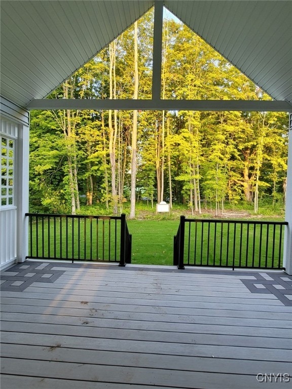 wooden deck with a yard