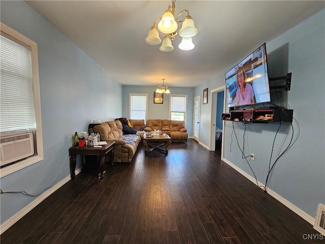 750 Lansing St, Utica, NY 13501 - living room with baseboards, cooling unit, a chandelier, and wood finished floors