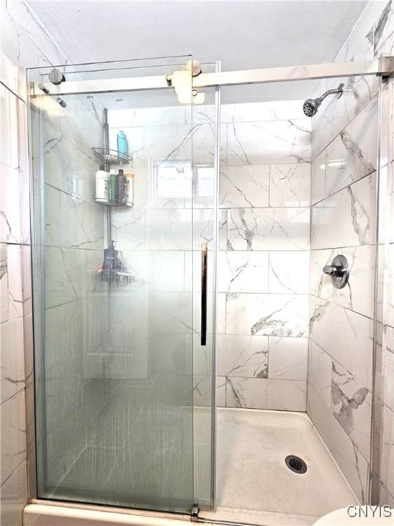 750 Lansing St, Utica, NY 13501 - bathroom featuring a stall shower