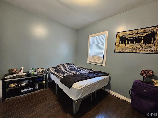 750 Lansing St, Utica, NY 13501 - bedroom featuring baseboards and dark wood-style floors