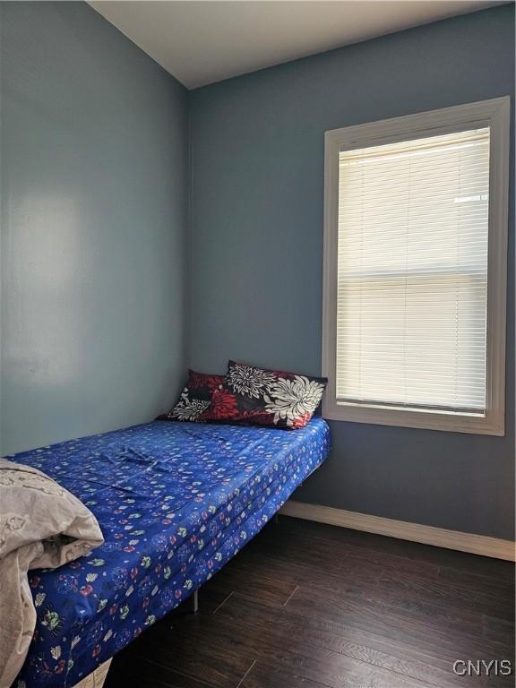 750 Lansing St, Utica, NY 13501 - bedroom featuring baseboards and wood finished floors