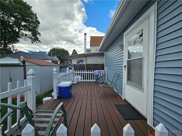 wooden deck with a shed