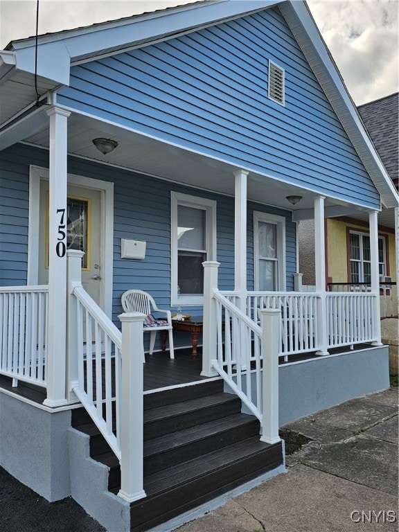 doorway to property featuring a porch