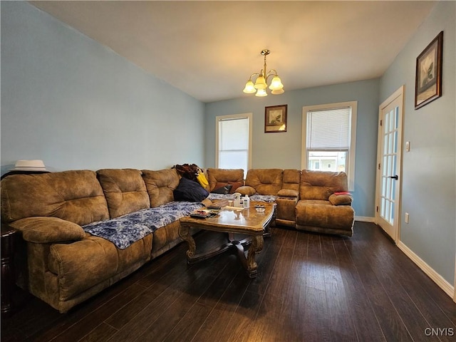 750 Lansing St, Utica, NY 13501 - living area with baseboards, dark wood finished floors, and a chandelier