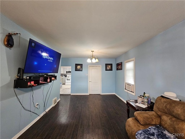 750 Lansing St, Utica, NY 13501 - living room with an inviting chandelier, wood finished floors, cooling unit, visible vents, and baseboards