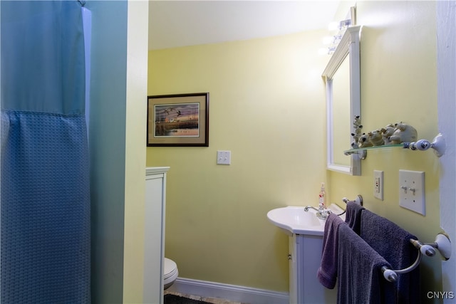 bathroom with vanity, toilet, and a shower with curtain