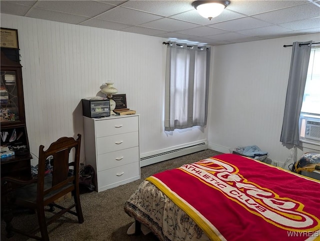 bedroom featuring a baseboard radiator, dark colored carpet, and a drop ceiling