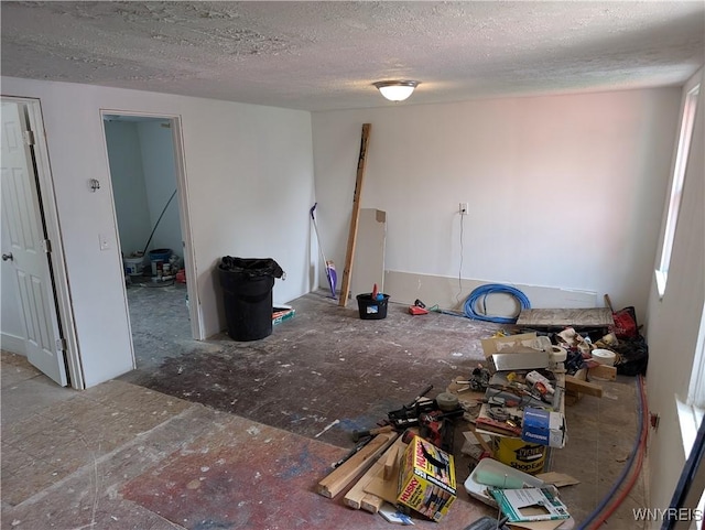 interior space with a textured ceiling