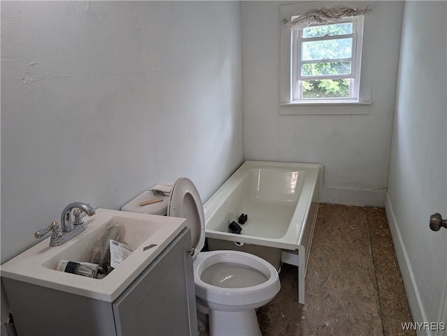 bathroom with a bath, toilet, and vanity