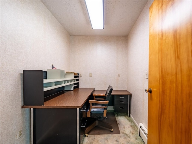 home office with a textured ceiling, baseboard heating, and carpet flooring