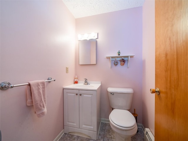 bathroom featuring a textured ceiling, vanity, tile patterned flooring, toilet, and baseboard heating