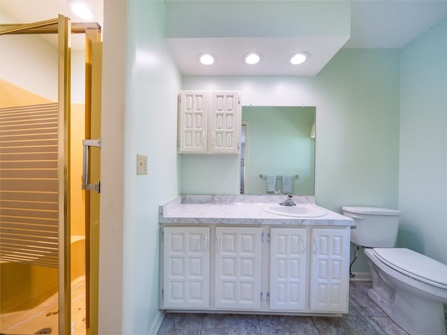 bathroom featuring toilet and vanity