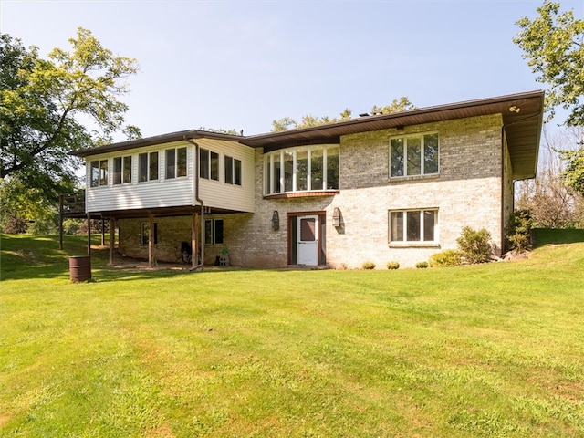 back of house with a lawn