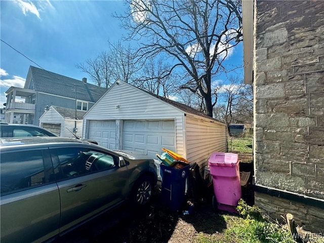 view of home's exterior with an outbuilding and a garage