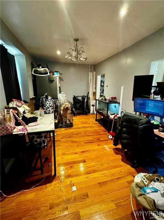 office area featuring hardwood / wood-style flooring and a chandelier