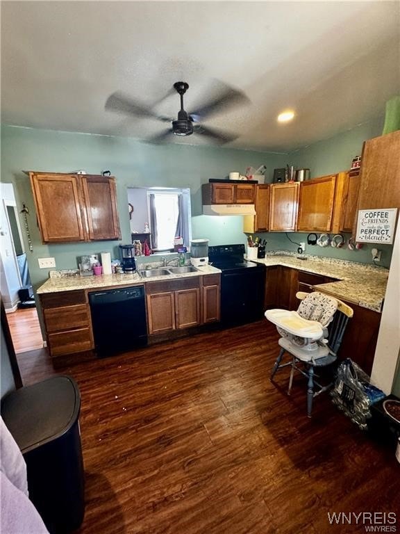 kitchen with black appliances, ceiling fan, dark hardwood / wood-style flooring, and sink