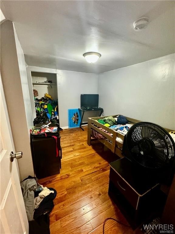 bedroom with hardwood / wood-style flooring