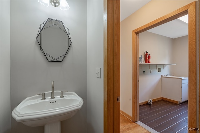 bathroom with sink and wood-type flooring