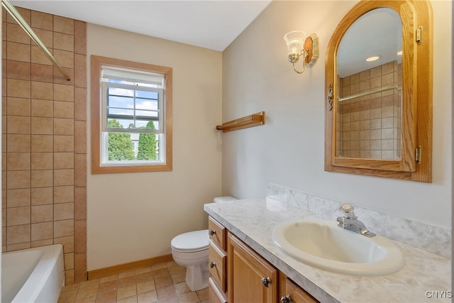 full bathroom featuring tiled shower / bath combo, vanity, toilet, and tile patterned flooring