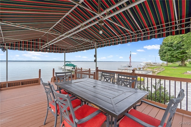 wooden terrace featuring a water view