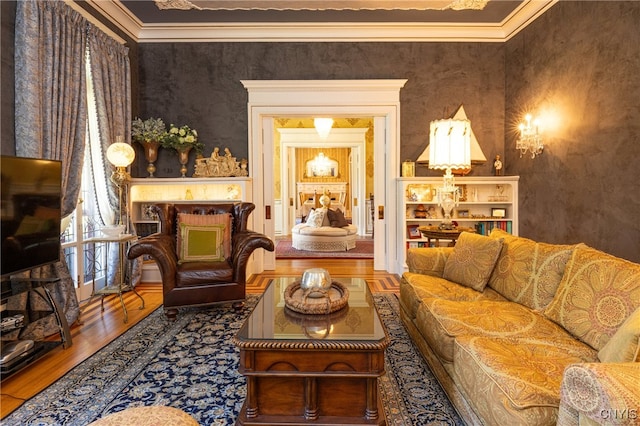 living room featuring ornamental molding and wood-type flooring