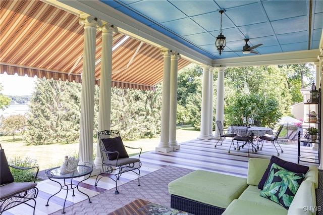 view of patio / terrace with ceiling fan, an outdoor hangout area, and a deck