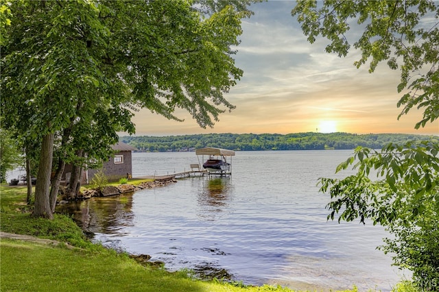 property view of water with a dock