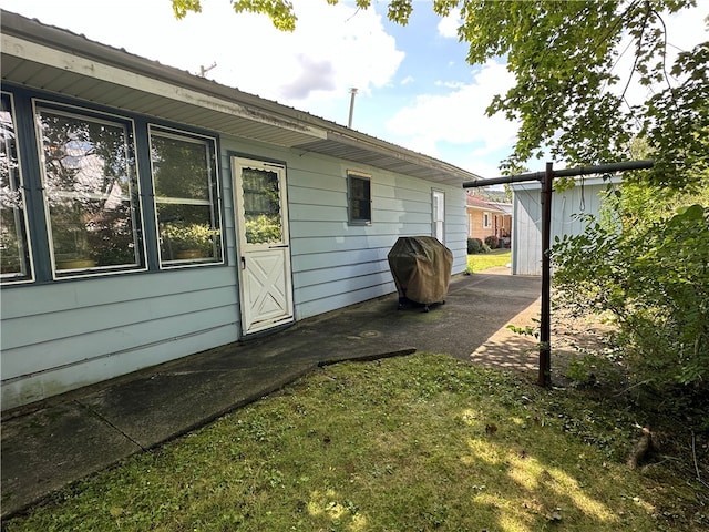 view of property exterior featuring a lawn