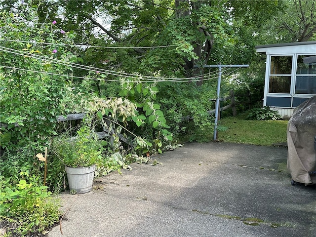 view of gate with a patio area