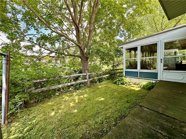 view of yard featuring a sunroom