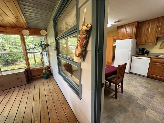 sunroom featuring wooden ceiling