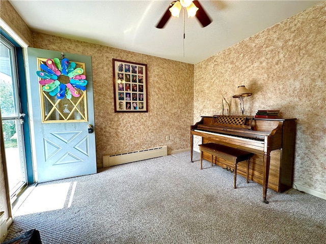 misc room featuring carpet, baseboard heating, and ceiling fan