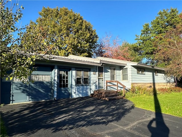 single story home featuring a garage