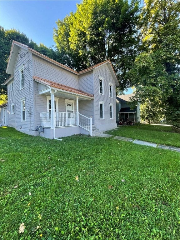 view of front of home with a front lawn and a porch