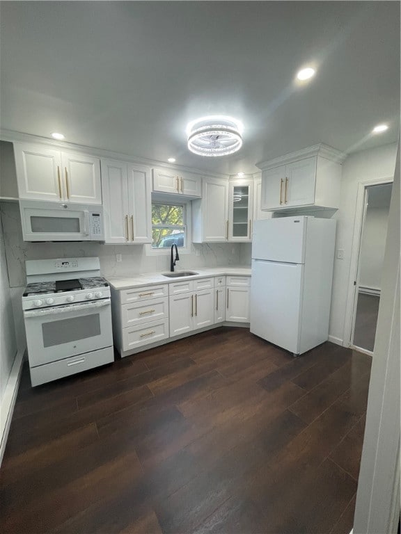 kitchen featuring white cabinetry, sink, white appliances, and dark hardwood / wood-style flooring