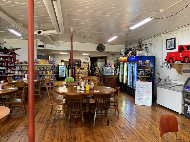 dining space with hardwood / wood-style floors