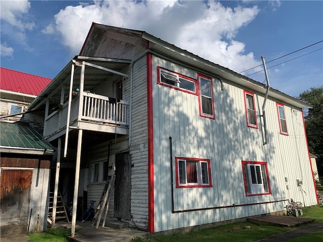 452 Main, Independence, NY 14897 - view of side of home with a balcony and a metal roof