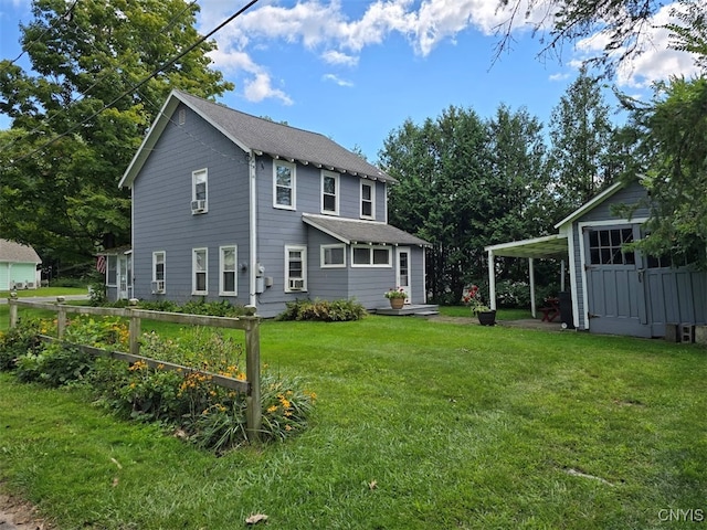 rear view of property featuring a lawn