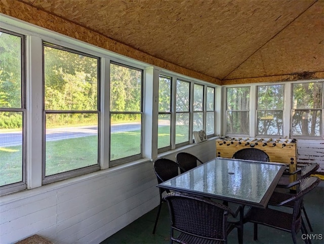 sunroom / solarium featuring lofted ceiling