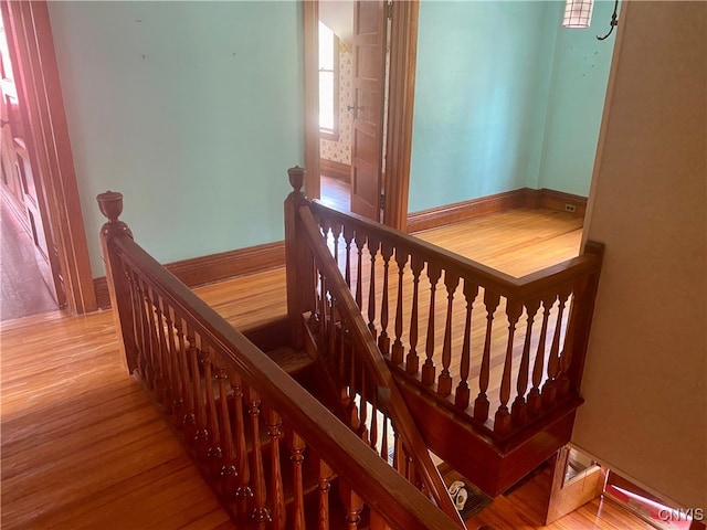 stairway featuring hardwood / wood-style flooring