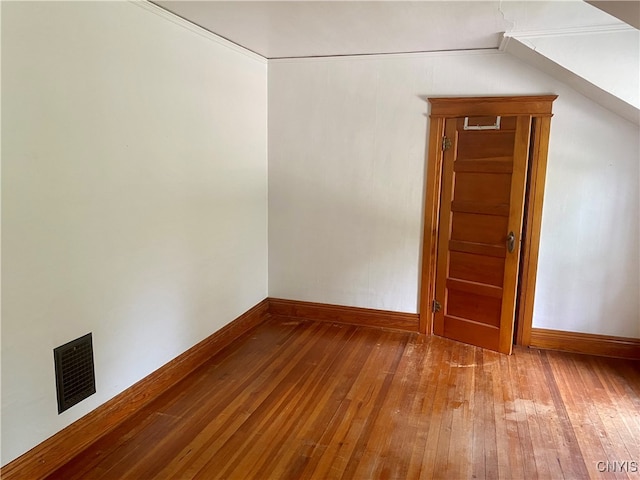 empty room with wood-type flooring