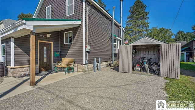 view of side of property featuring a patio