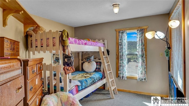 bedroom featuring multiple windows and carpet flooring